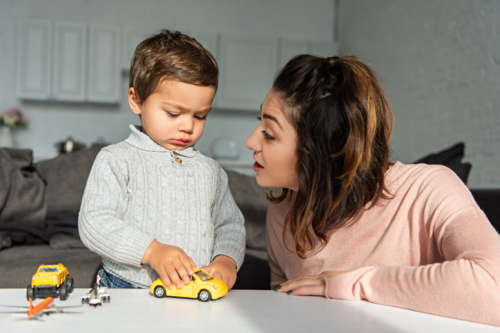 Mom and son playing cars