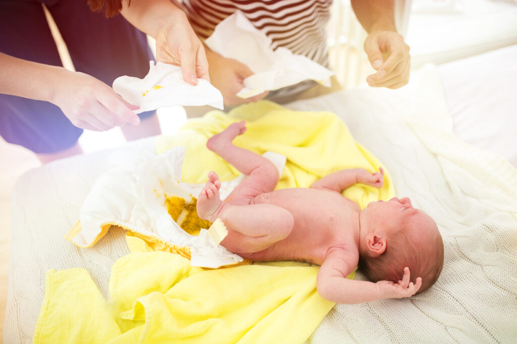 Changing a newborn baby can be challenging.