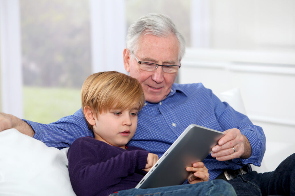 Grandfather reads to his grandson