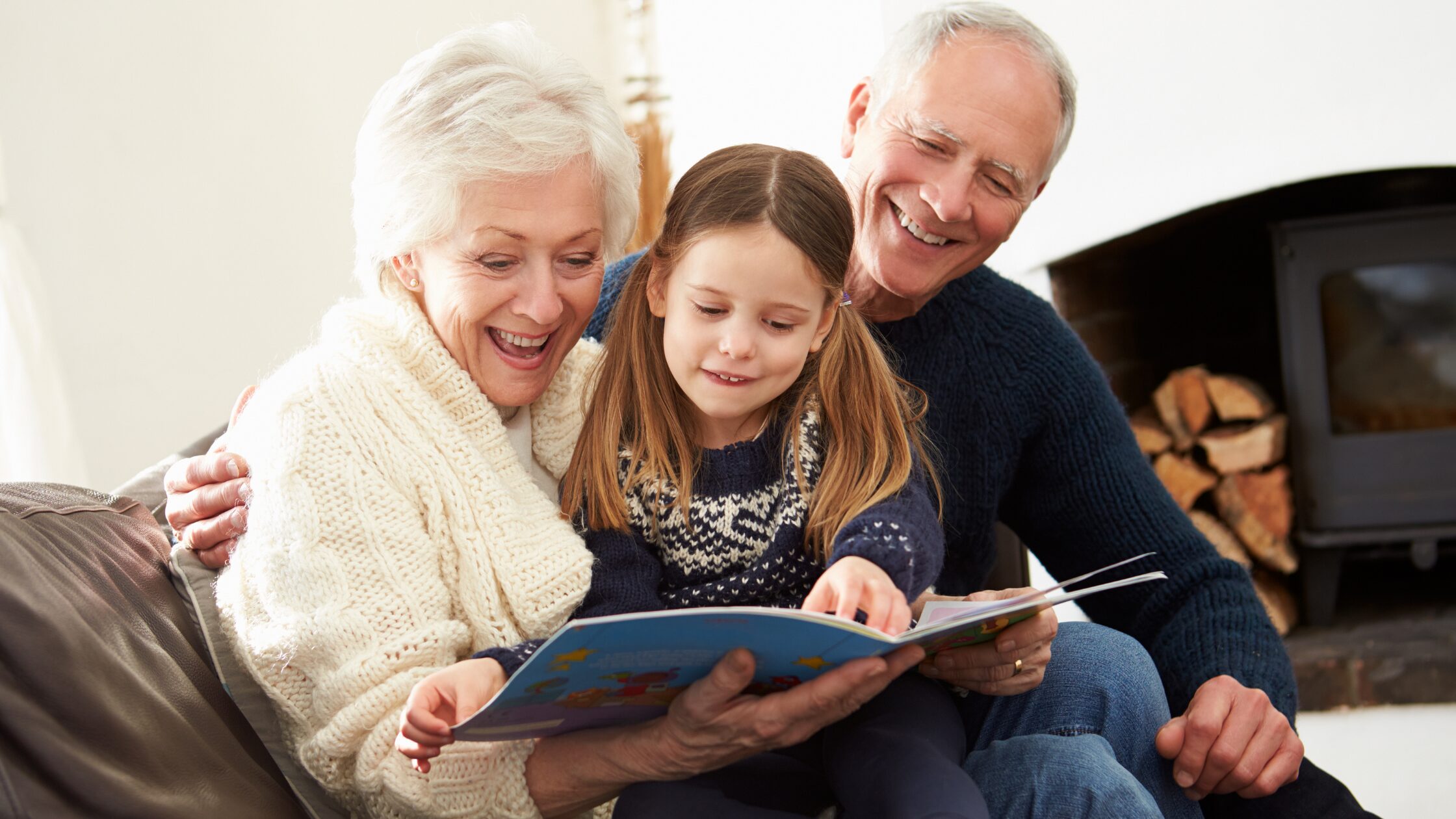 grandparents reading to grandchild