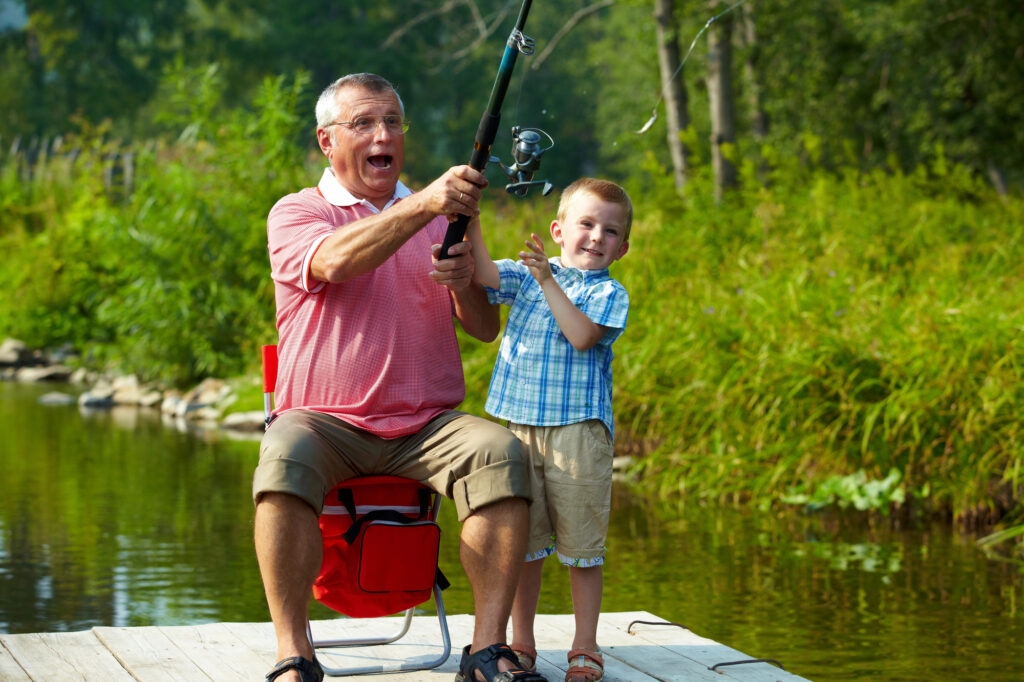 grandparent fishing with grandson
