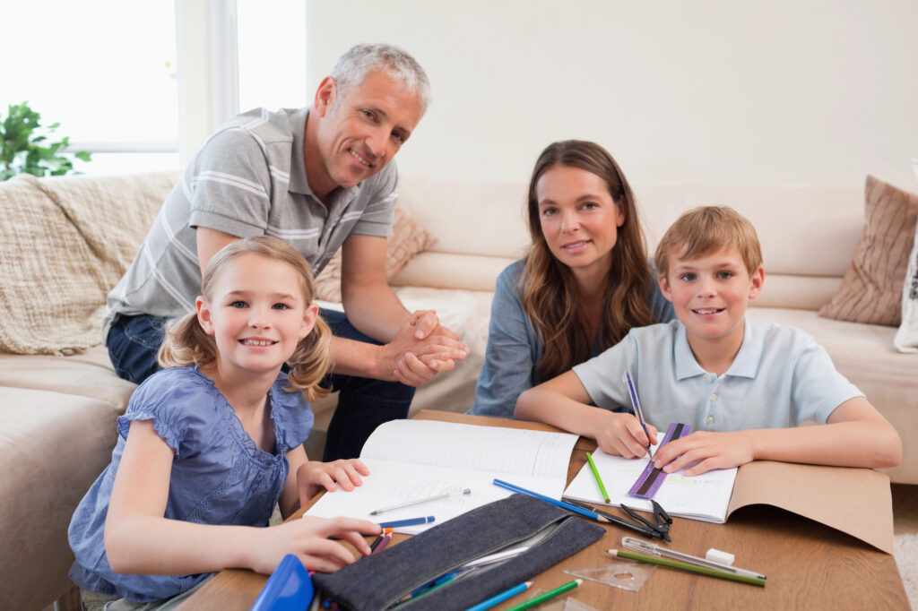 Happy Family working on a vision board together.