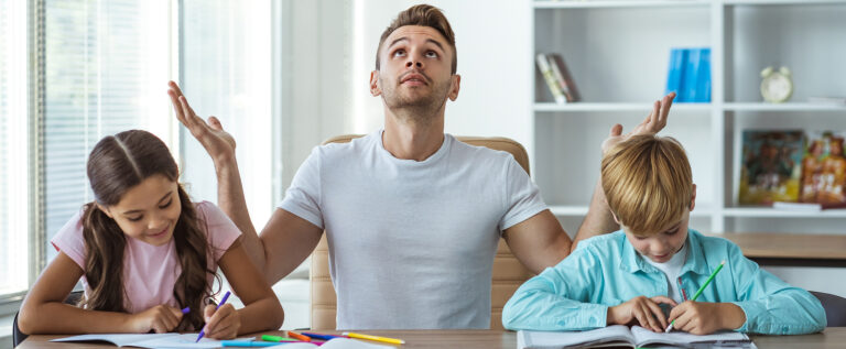 Frustrated dad trying to help kids with homework
