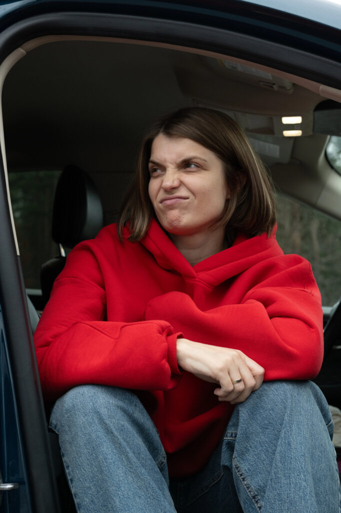 Mom sitting alone in minivan